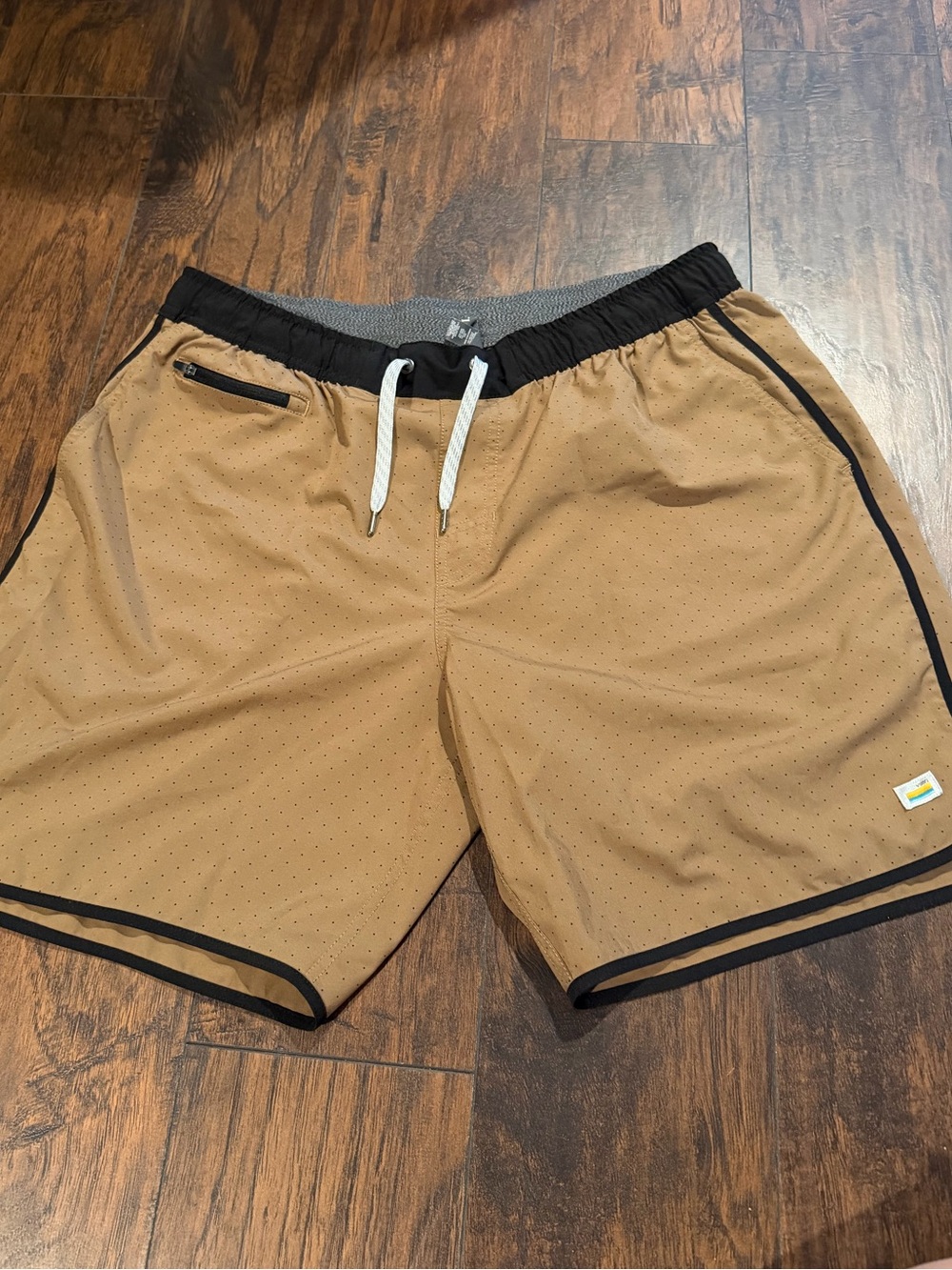 Vuori Tan Athletic Shorts with Black Trim